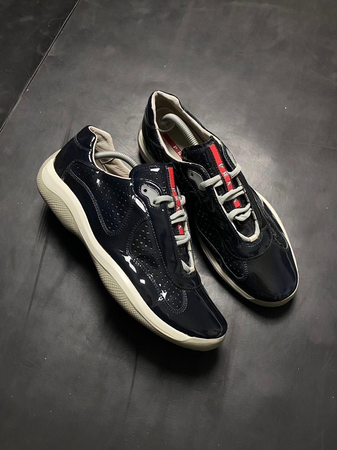 Prada Americas Cup Perforated Patent Trainers by PRADA in size AU/UK 10 from SHOES category