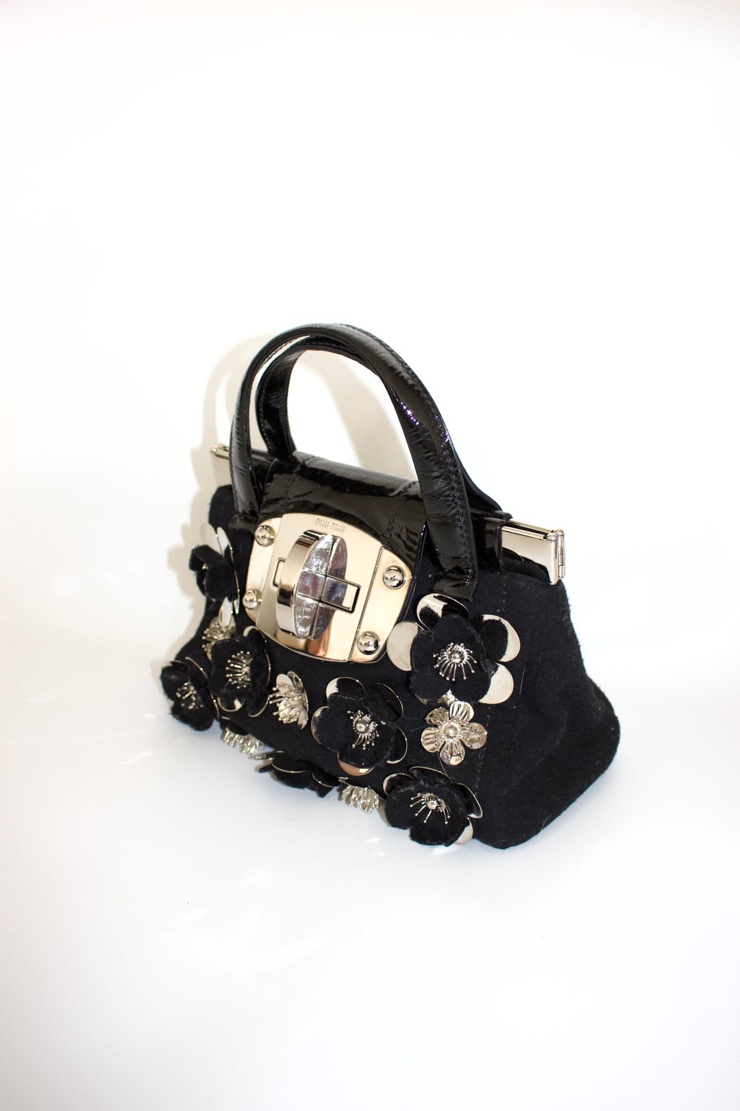 Miu Miu FW2010 black handbag with metallic flowers by MIU MIU in size ONE SIZE from BAGS category