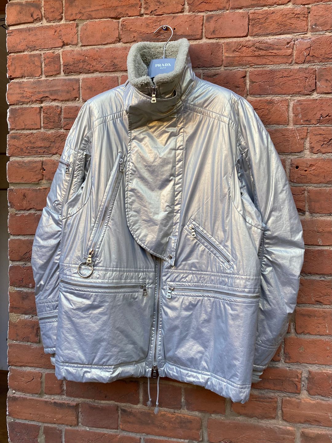 Prada Sport Asymmetrical Metallic Parka by PRADA in size ONE SIZE from COATS & JACKETS category