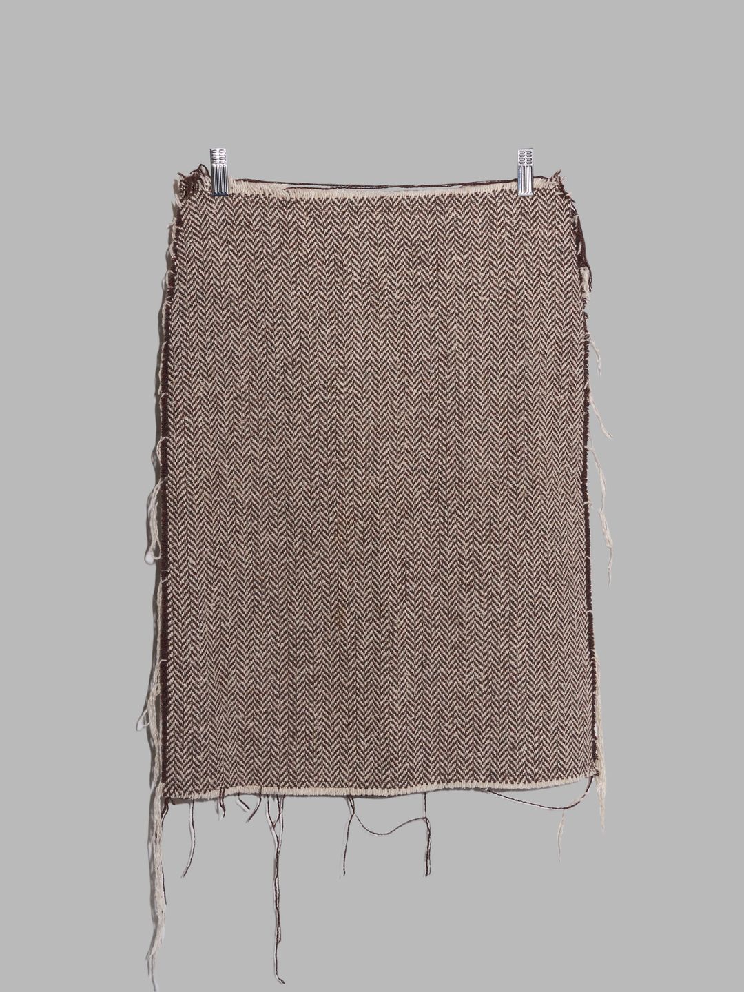 Jean Colonna brown herringbone wool raw edge knee length skirt by Jean Colonna in size IT 42 from SKIRTS category