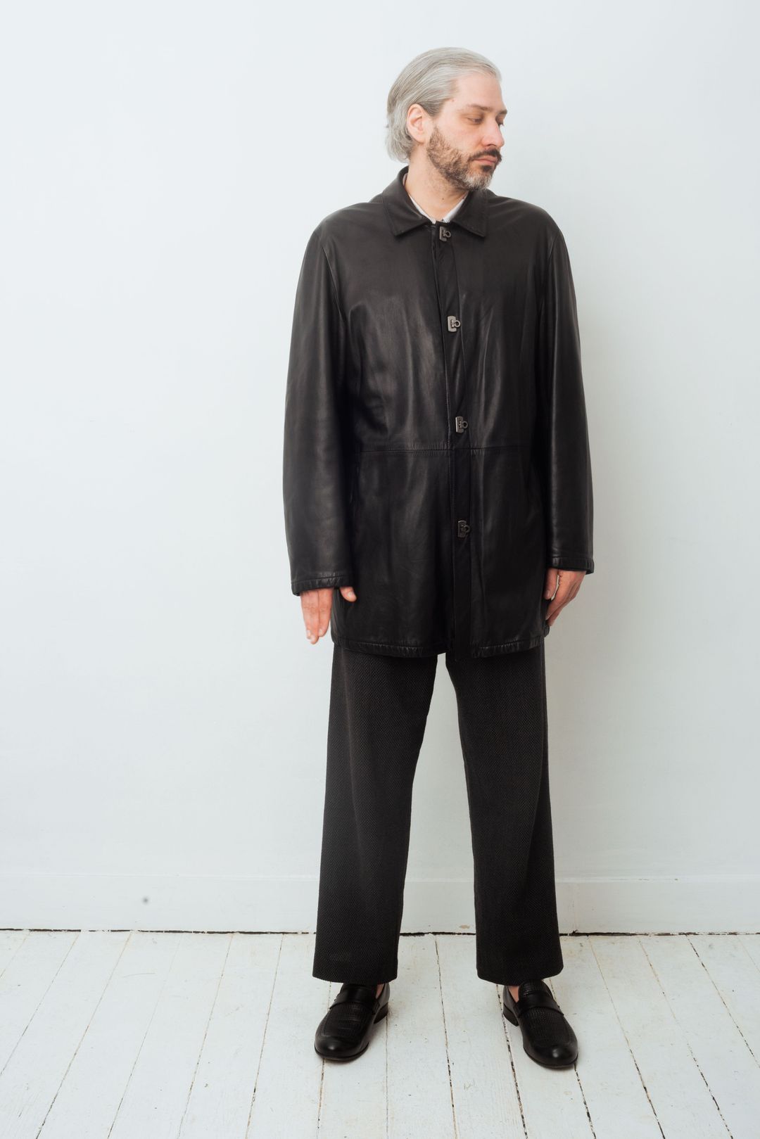 Salvatore Ferragamo 80's black leather coat with special closure by Salvatore Ferragamo in size ONE SIZE from COATS & JACKETS category