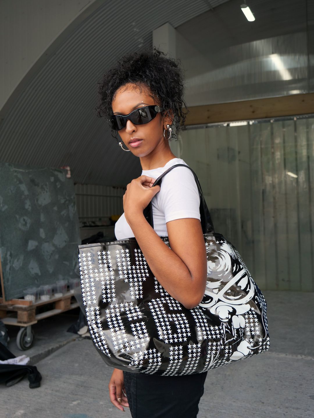 Black Printed Graphic Bag by HYSTERIC GLAMOUR in size ONE SIZE from ACCESSORIES category
