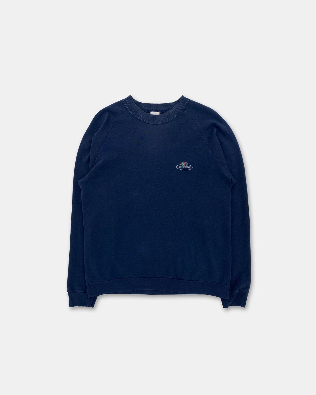 Fruit of the Loom 1990s Logo Raglan Crewneck Navy by Fruit of the Loom in size ONE SIZE from KNITWEAR category