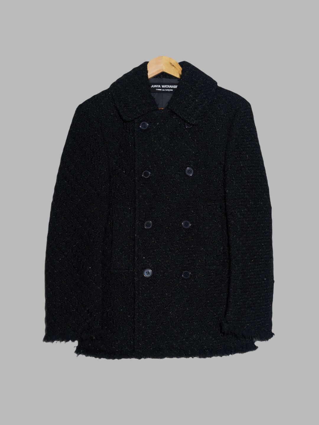 Junya Watanabe Comme des Garcons black wool boucle unfinished hem pea coat by COMME DES GARÇONS in size ONE SIZE from COATS & JACKETS category
